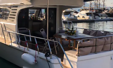 Kemer budget yacht rental at marina with turquoise sea and yachts ready for private tours.