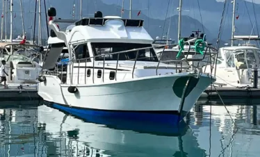 Affordable yacht rental in Kemer during a sunset cruise on the Mediterranean Sea.