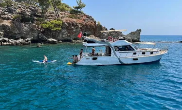 Swimming stop in turquoise waters on a budget yacht trip from Kemer.