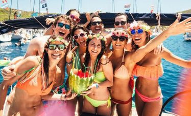 Tourists dancing during foam party on pirate boat in Kemer