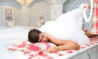 Guests relaxing with herbal tea in the Turkish bath lounge