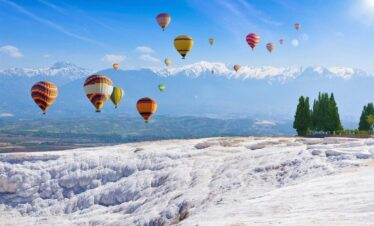 Collage with hot air ballons flying above snowy white Pamukkale in Turkey. Pamukkale is geological phenomenon, literally "Cotton Castle" in Turkish, most visited attraction in Turkey.