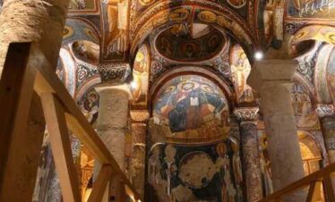 Ancient cave museum ceiling with intricate carvings in Cappadocia Red Tour