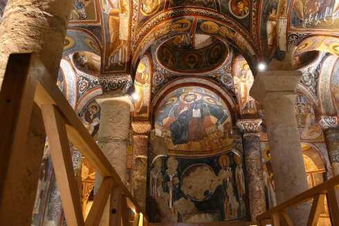 Ancient cave museum ceiling with intricate carvings in Cappadocia Red Tour