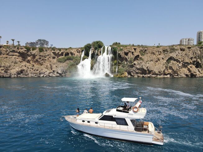 lara waterfall with yacht