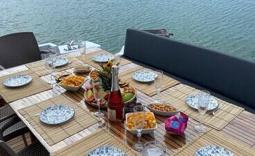 Elegant dining table aboard a luxury yacht, perfect for onboard meals