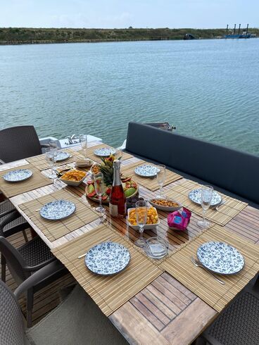 Elegant dining table aboard a luxury yacht, perfect for onboard meals
