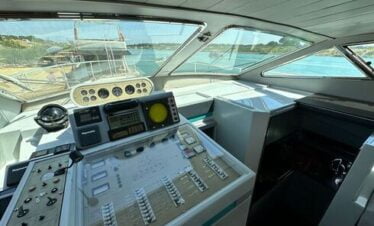 Interior view of a luxury yacht's control room with modern navigation equipment