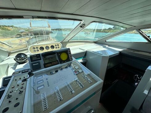 Interior view of a luxury yacht's control room with modern navigation equipment