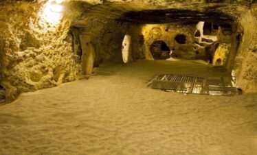 Interior view of a cave in Cappadocia, showcasing ancient rock dwellings and unique formations