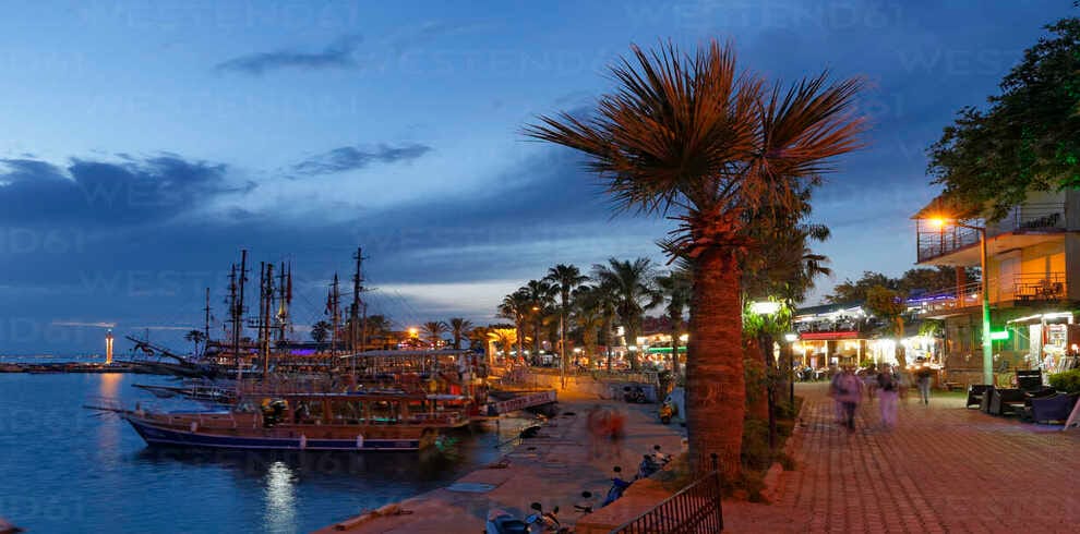 Side harbor with boats docked along the Mediterranean coastline