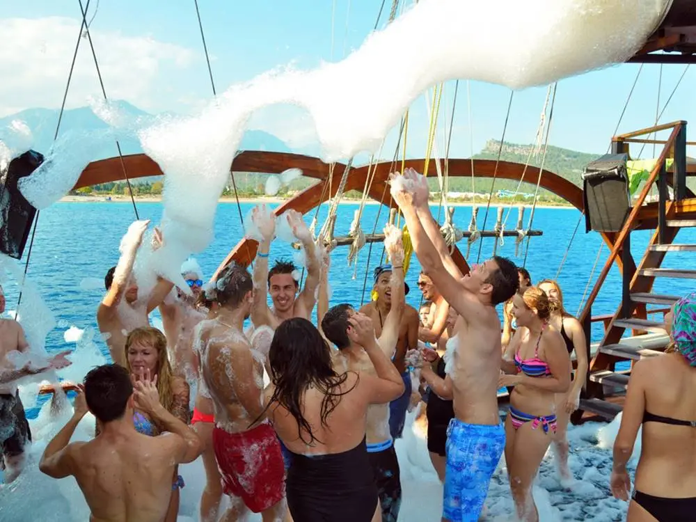 Guests participating in the foam party on the pirate boat.