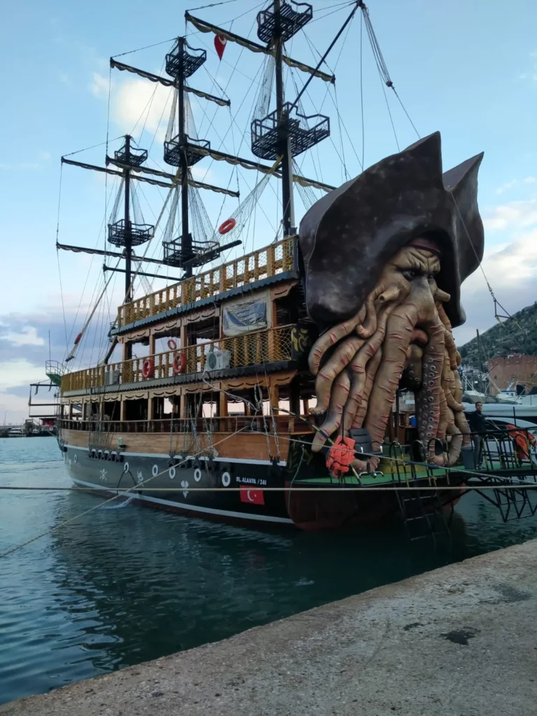 Sea turtles swimming alongside the pirate boat during the open sea journey.
