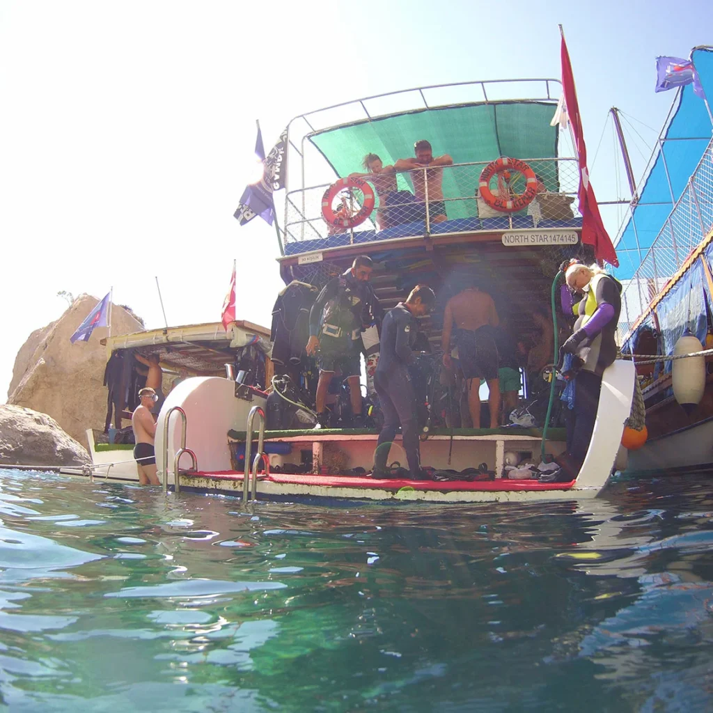 Certified diving instructors posing before the scuba diving session in Kemer