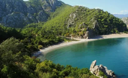 Ancient ruins of Olympos in Antalya surrounded by green forest and historical stone arches
